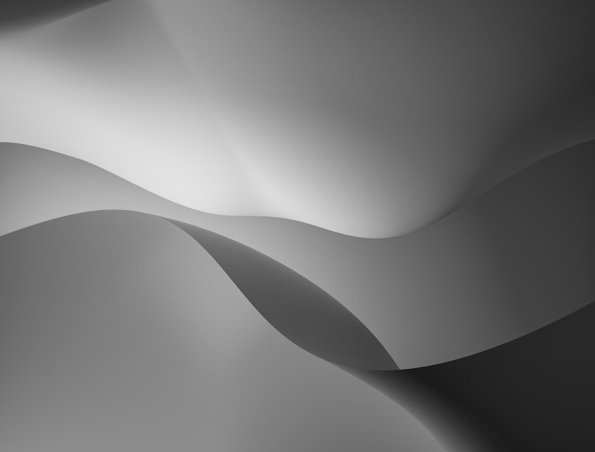 Abstrakte graue Wellenformen, minimalistisch gestaltet.